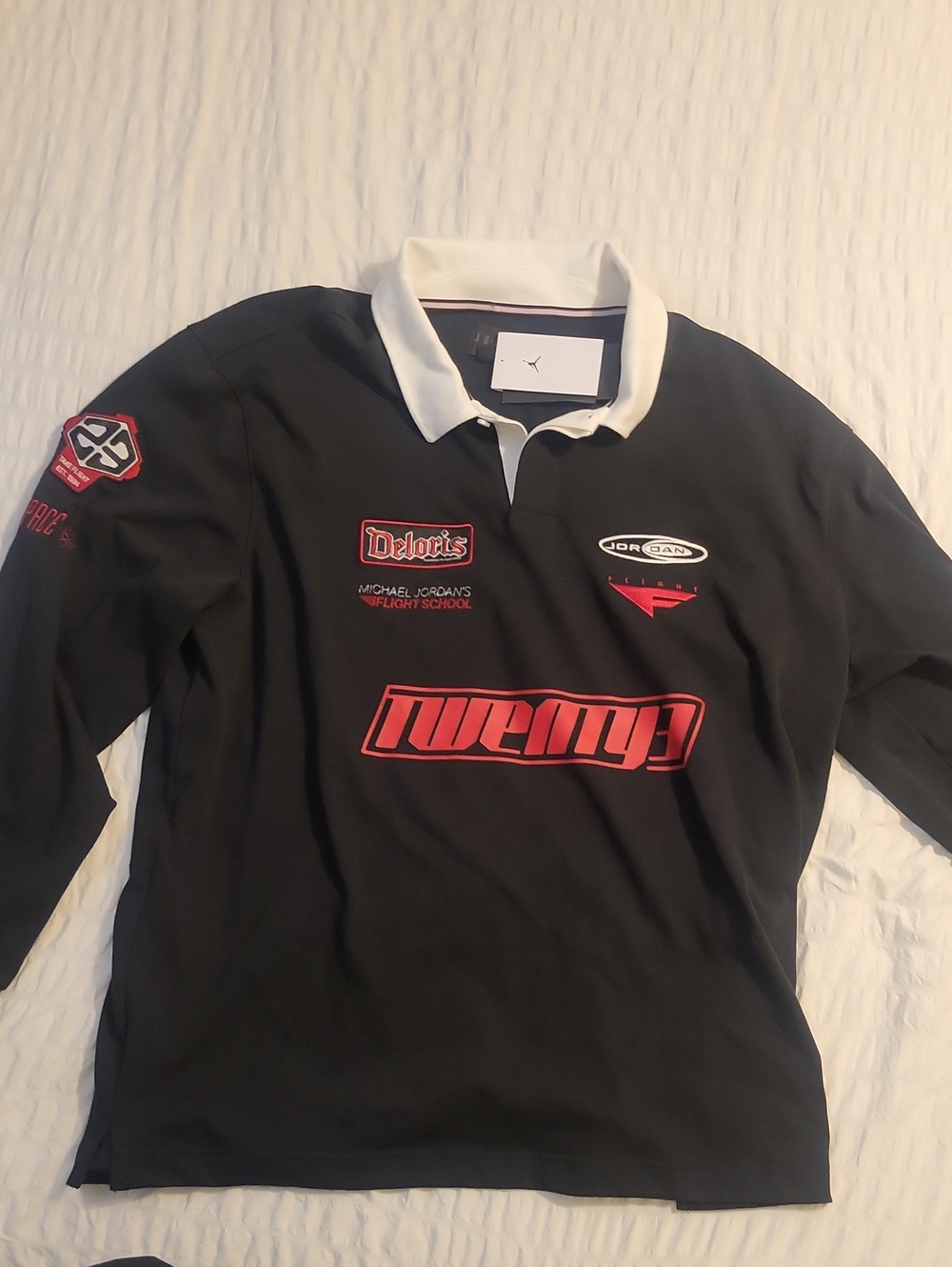 Jordan Black Long-Sleeve Polo with White Collar and Red Graphics